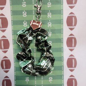 Football Themed Wristlet Keyring with a Football related charm attached !!